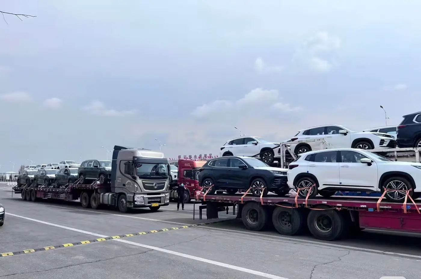 Car carrier trucks transporting vehicles for export